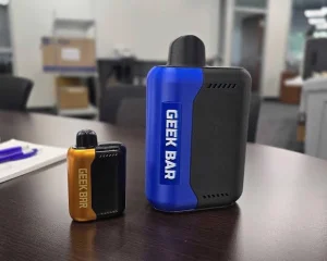 Click to view full screen Small yellow Geek Bar device beside a larger blue Geek Bar device